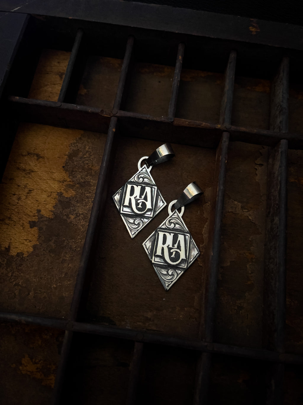Diamond pendant with initials/brand