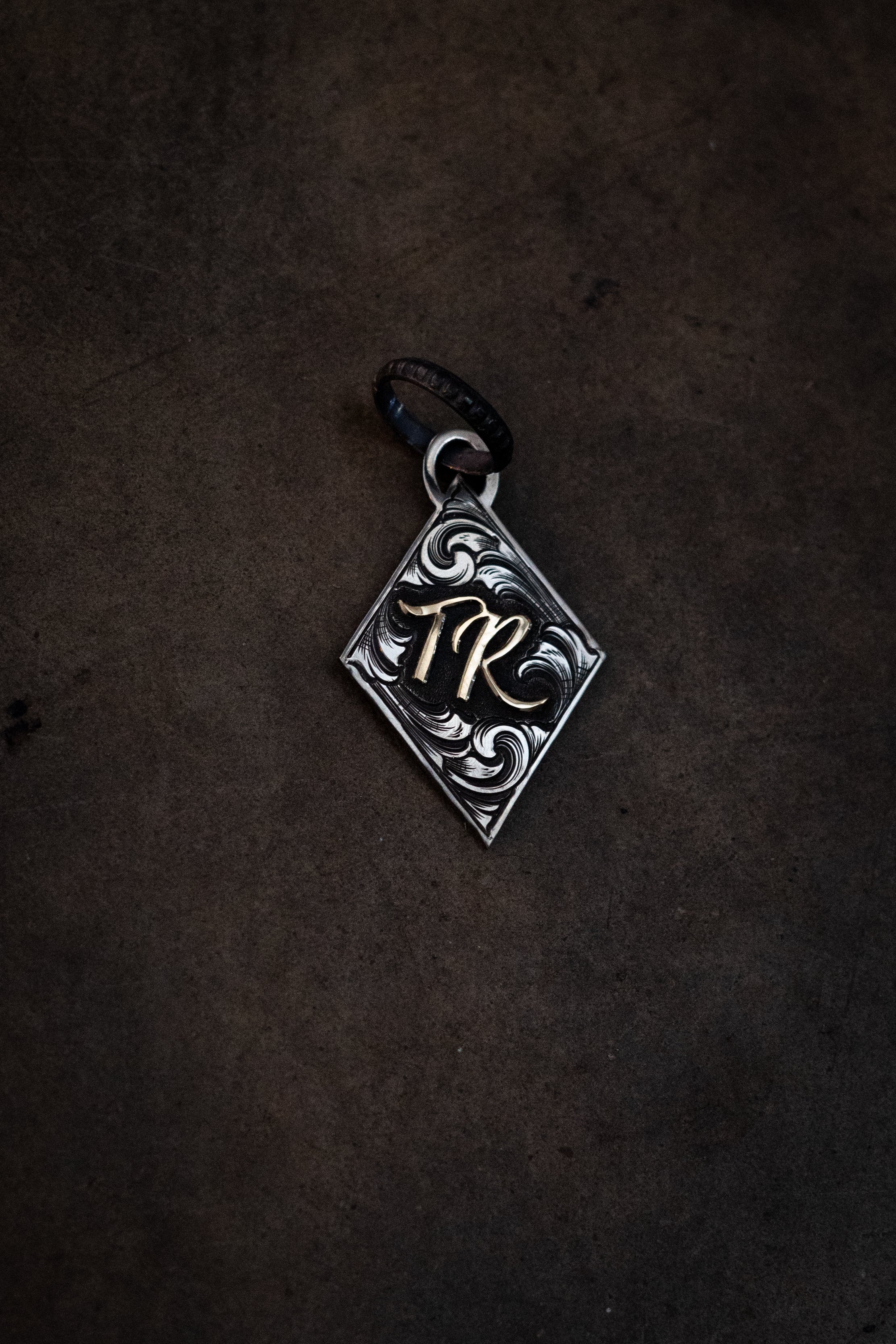 Diamond pendant with initials/brand