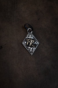 Diamond pendant with initials/brand
