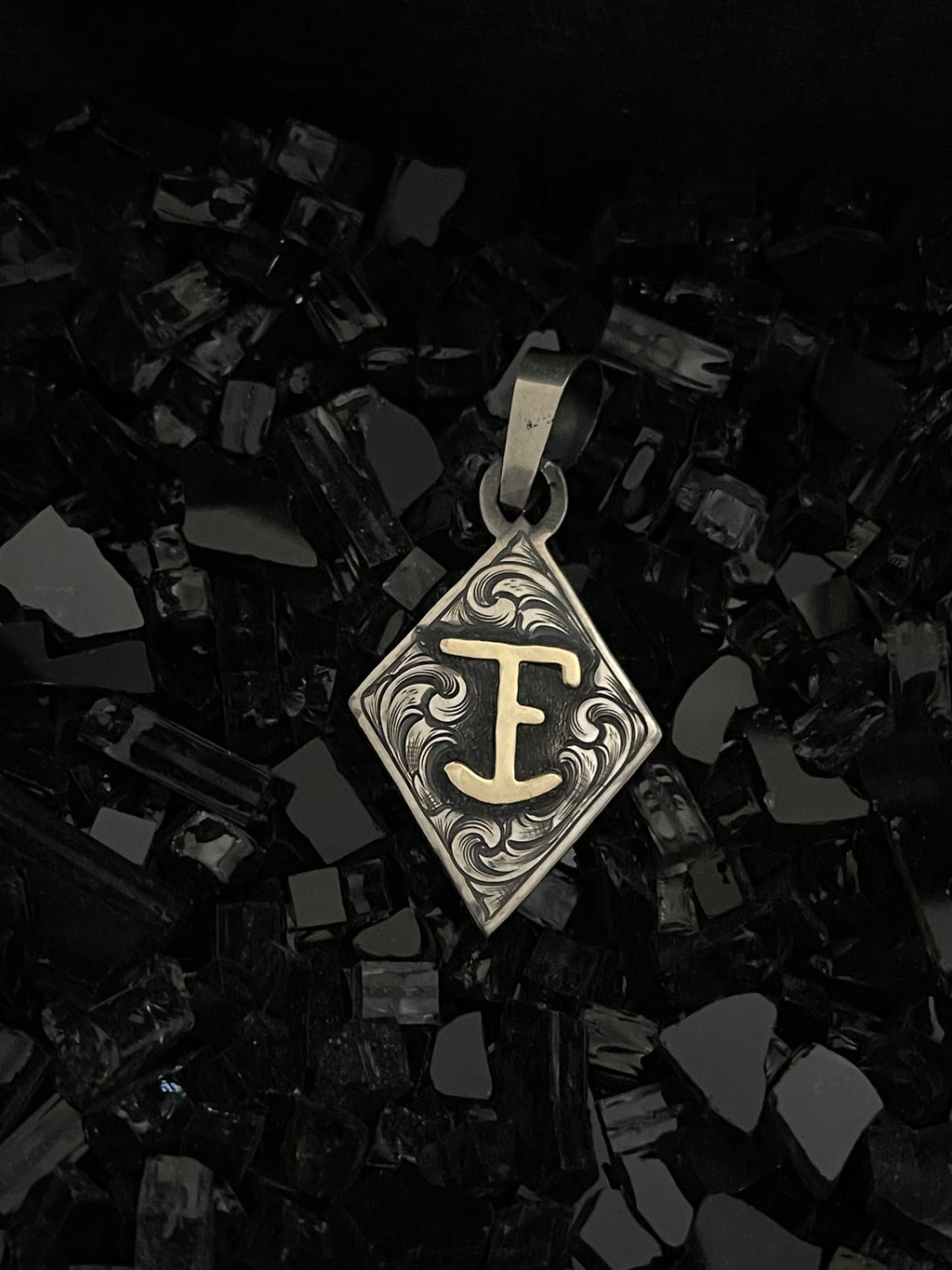 Diamond pendant with initials/brand