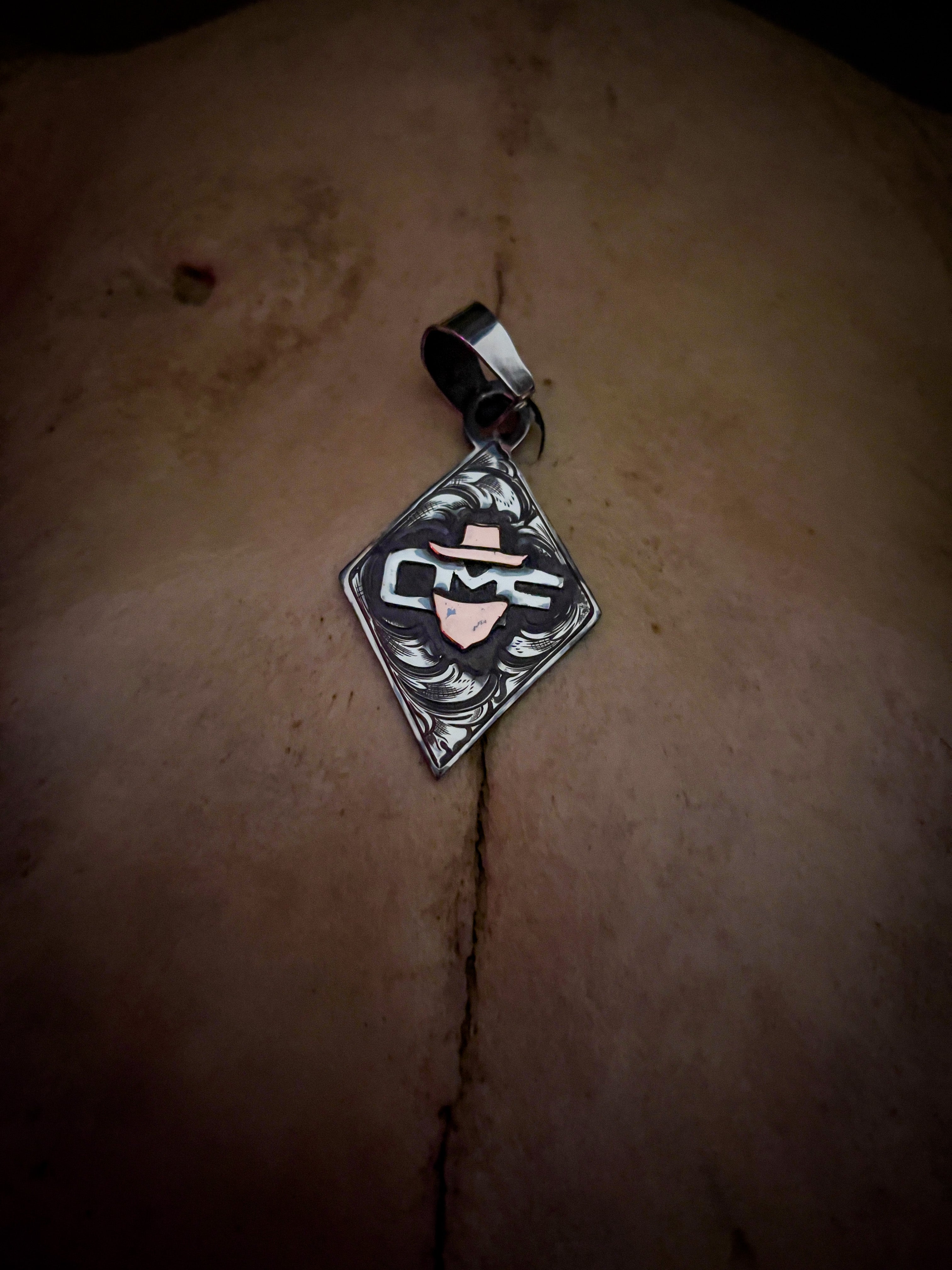 Diamond pendant with initials/brand