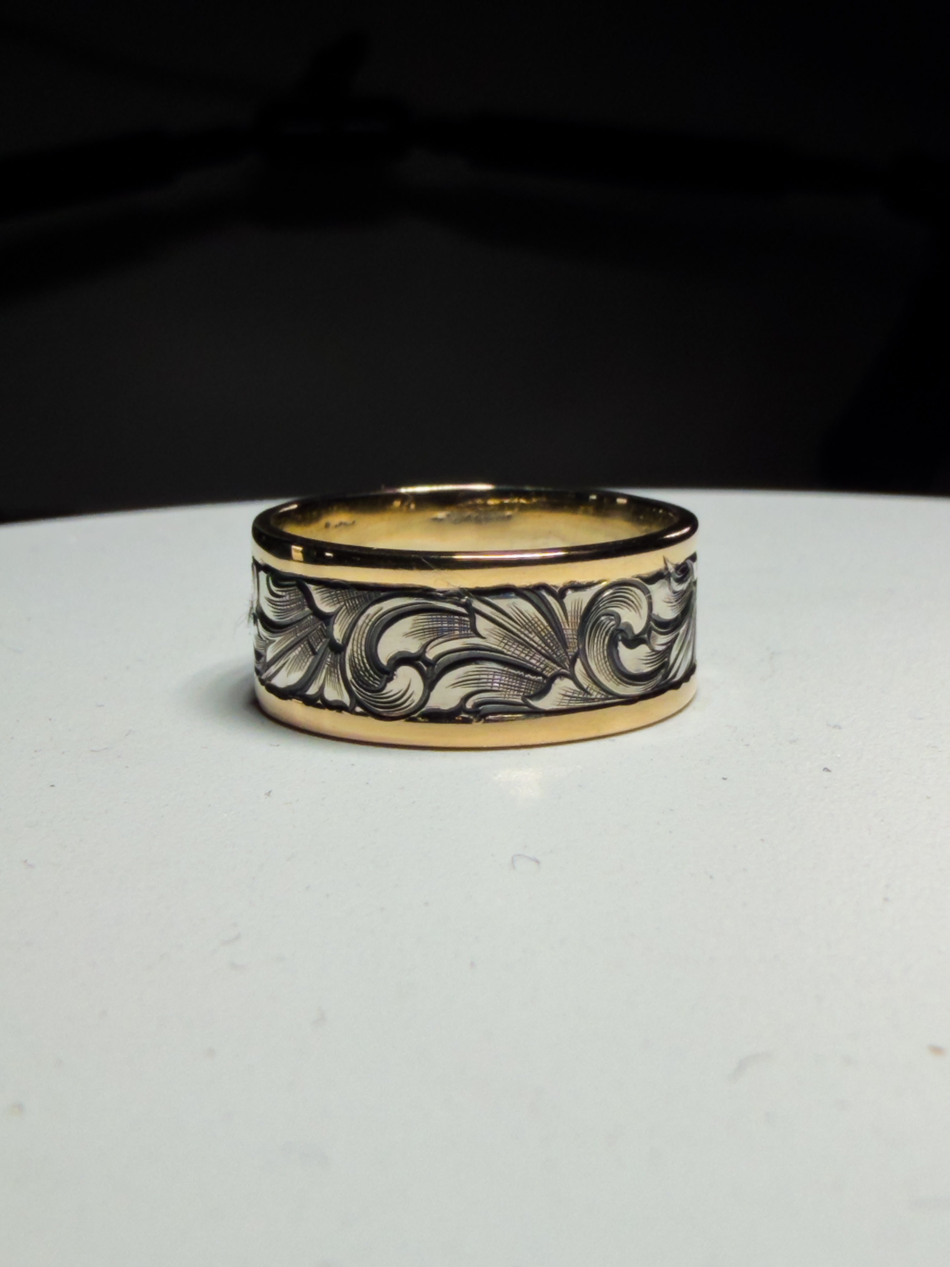 Sterling silver wedding band with 14k gold borders